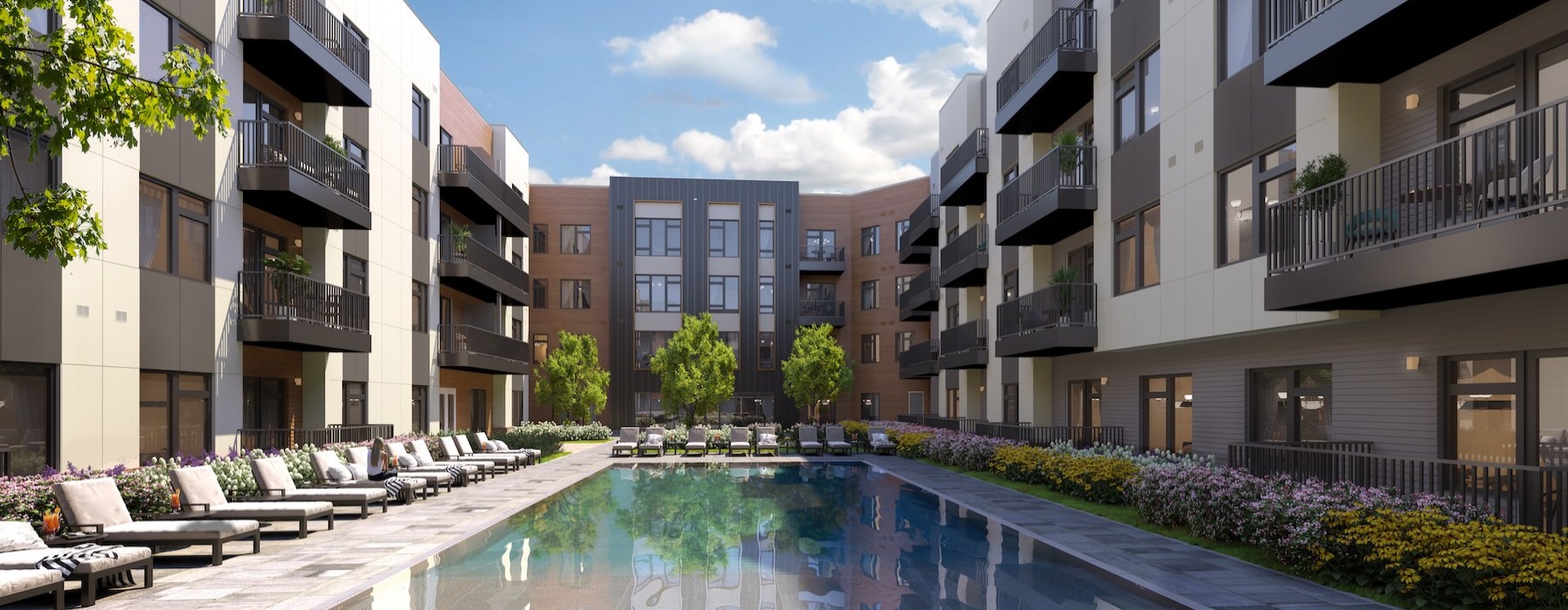 a pool with chairs in between buildings